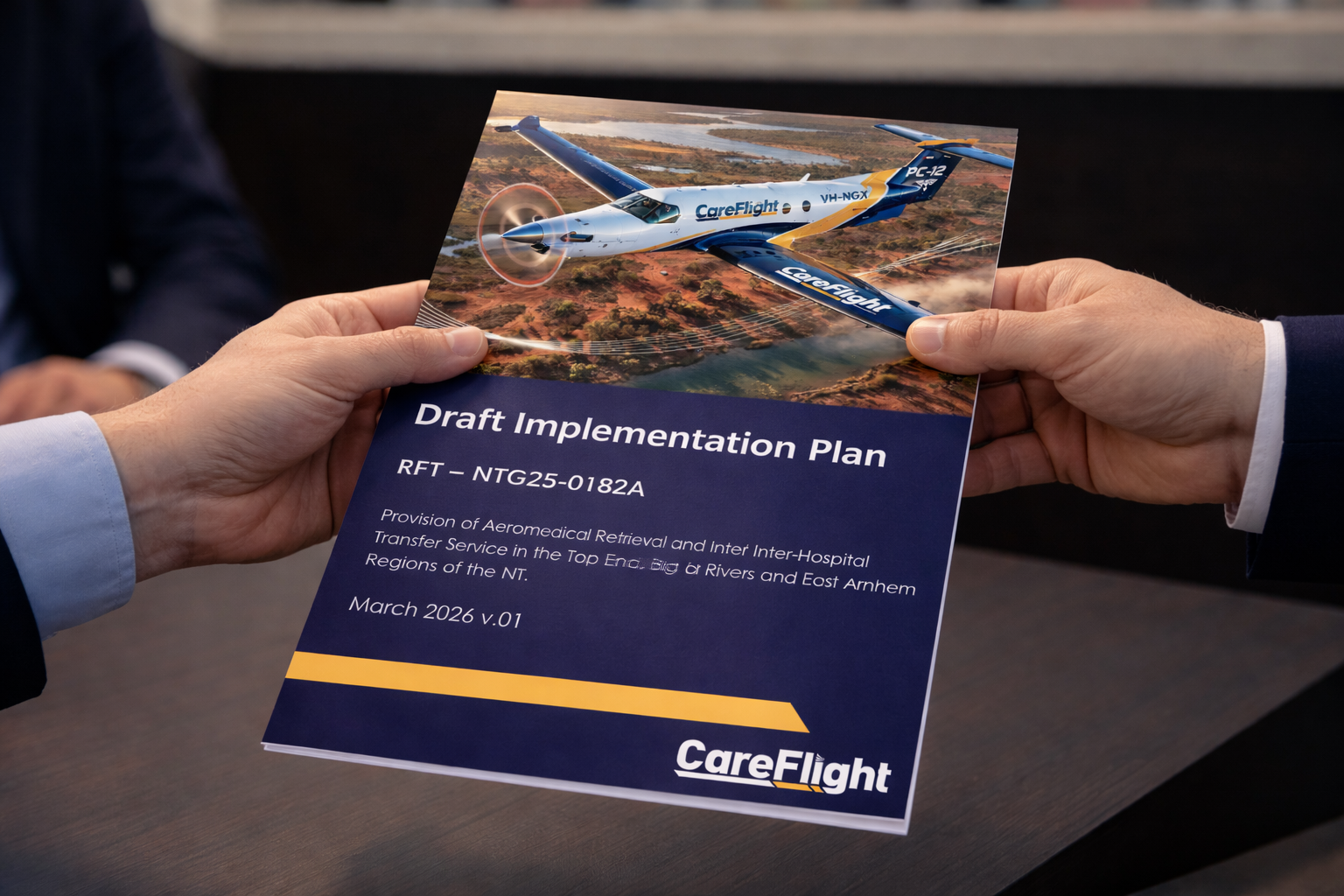 CareFlight Draft Implementation Plan document held by two hands with a blurred background